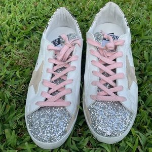 Super-Star Golden Goose with snake print, glitter and pink laces.